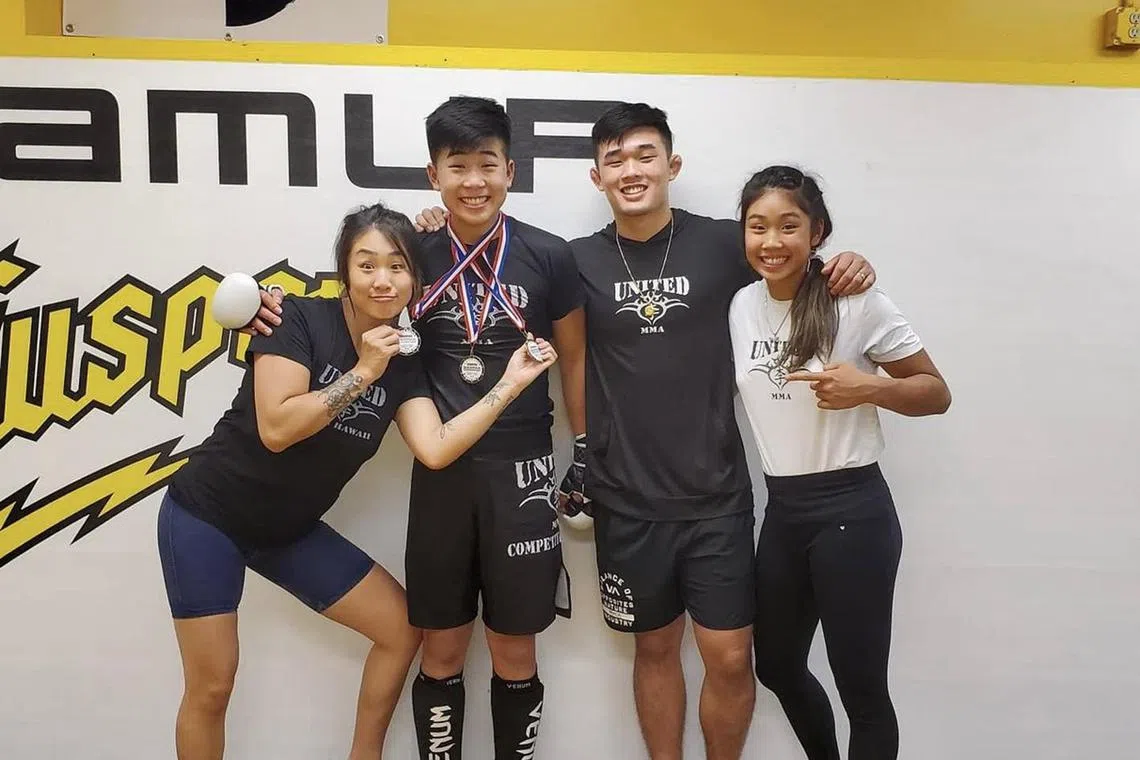 dlmma23 - (from left) Angela, Adrian, Christian and the late Victoria Lee are tight-knit mixed martial arts siblings who are part of One Championship, with Adrian set to make his debut on June 8.



Credit: Adrian Lee