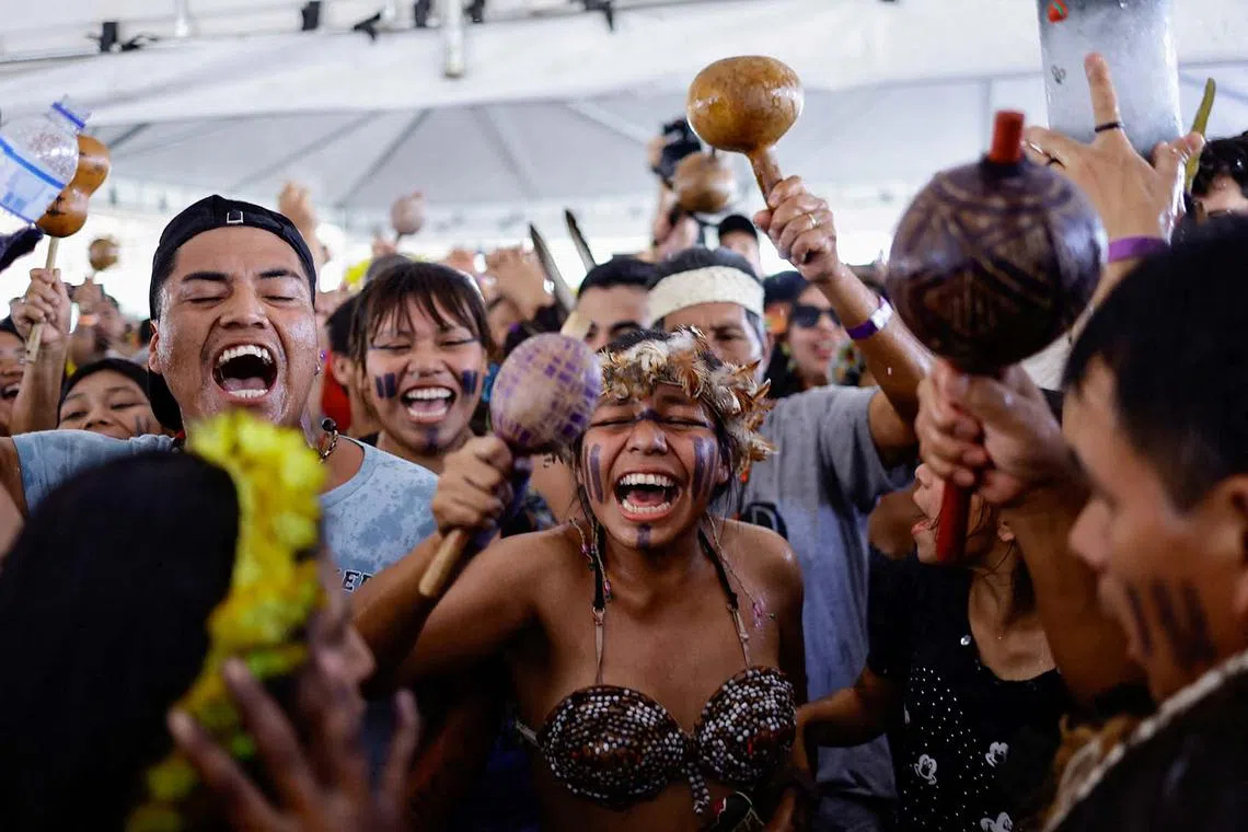 Brazilian Xokleng Indigenous people celebrate after a majority in Brazil's Supreme Court voted against the so-called legal thesis of 'Marco Temporal' (Temporal Milestone), in Brasilia, Brazil, Sept 21.