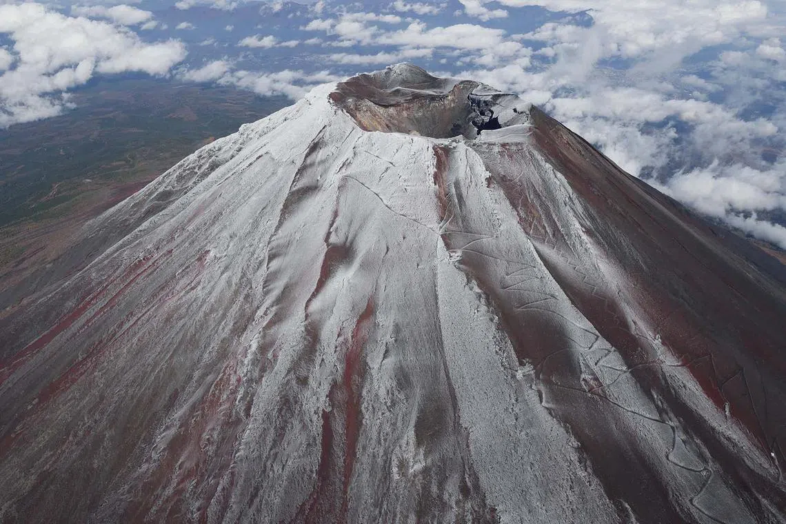 The top of Mount Fuji seen covered by snow in Japan, Nov 6, 2024. Snow has finally fallen on Mount Fuji, after the Japanese mountain’s longest-ever stint with bare slopes.