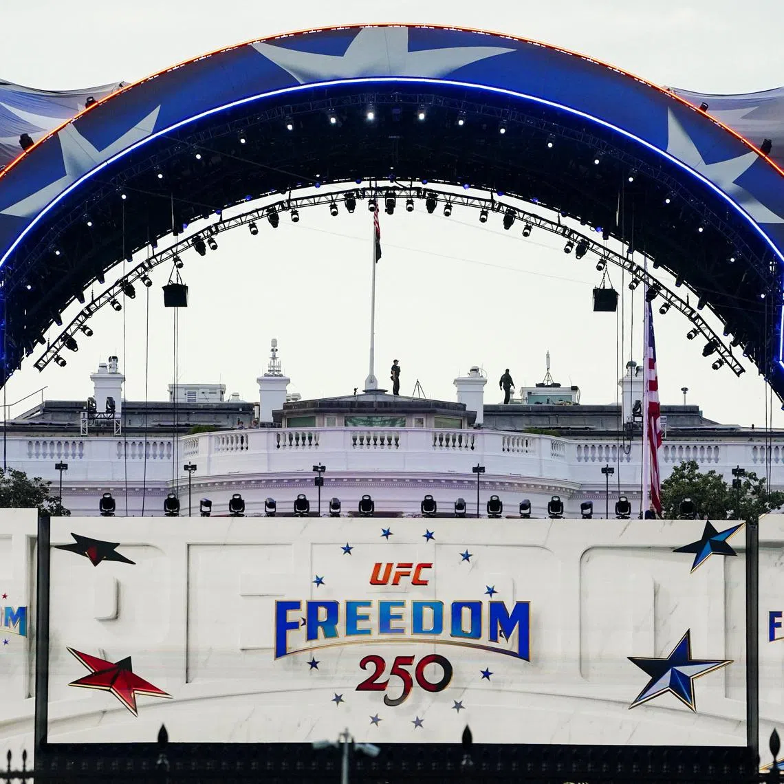 Security personnel stand atop the White House ahead of the ceremonial weigh-ins for fighters participating in UFC Freedom 250, at the Ellipse near the White House, in Washington, D.C., U.S., June 13, 2026. REUTERS/Nathan Howard