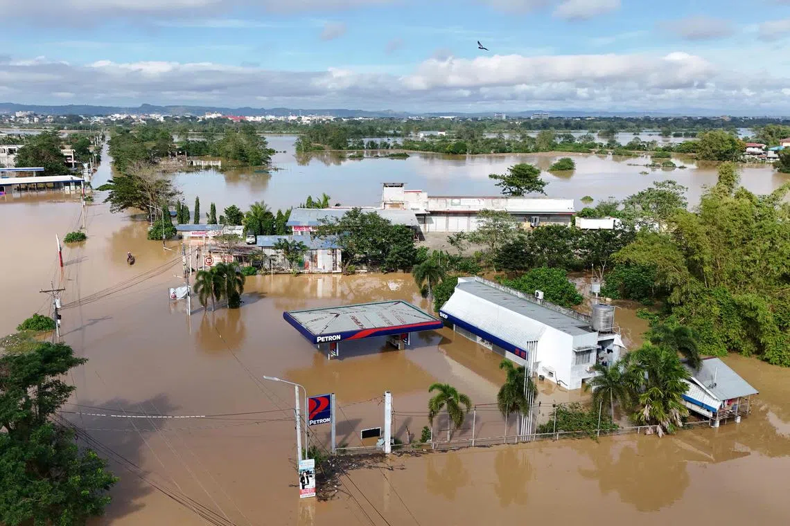 Buildings submerged in floodwaters caused by heavy rains from Super Typhoon Man-yi in Tuguegarao City, Cagayan province on Nov 19, 2024. 