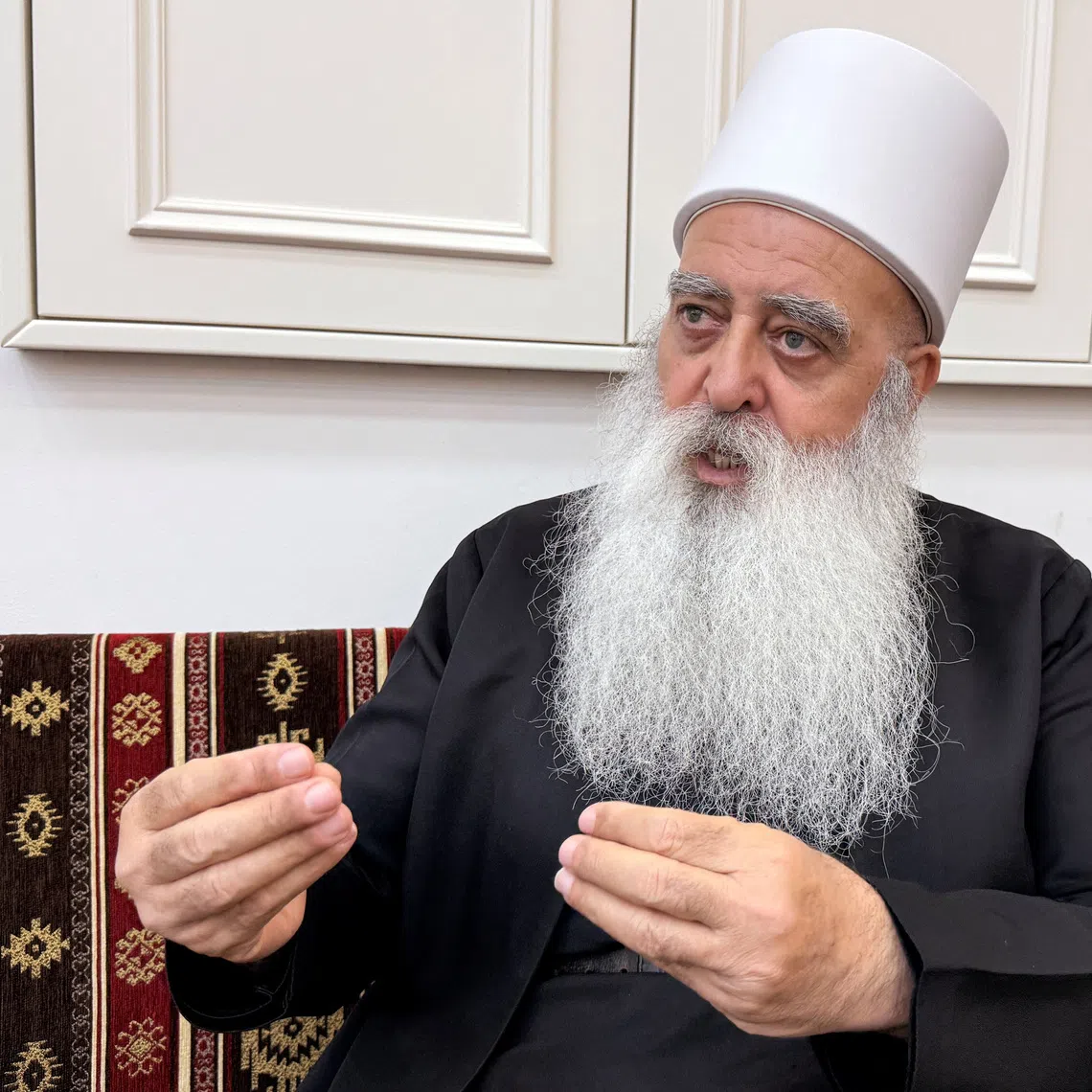 Leader of the Druze community in Israel, Sheikh Mowafaq Tarif, speaks with Reuters at his house in Julis, northern Israel July 28, 2025. REUTERS/Ali Sawafta