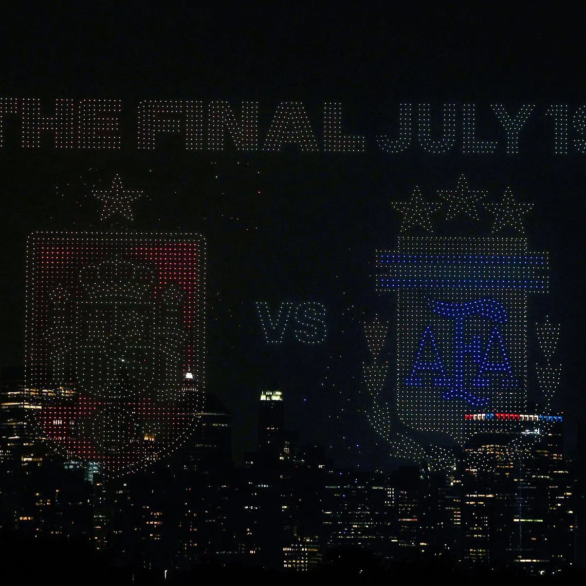 Jul 15, 2026; Jersey City, New Jersey, USA; A general view of a drone show above Liberty State Park with the New York City skyline in the background ahead of the FIFA World Cup 2026 Final between Spain and Argentina. Mandatory Credit: Vincent Carchietta-Imagn Images