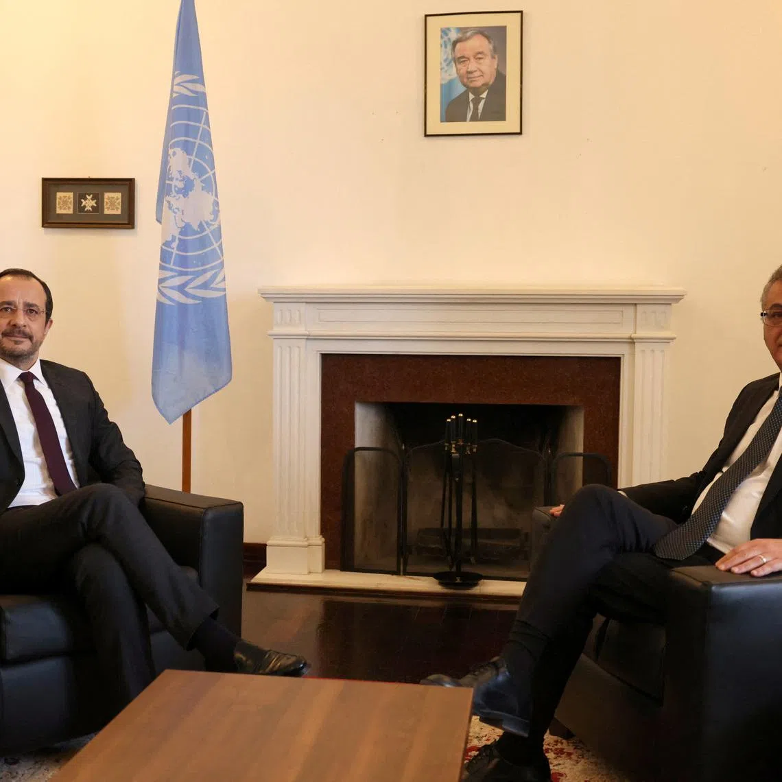Cyprus President Nikos Christodoulides, who leads Cyprus's Greek Cypriot community, and Turkish Cypriot leader Tufan Erhurman pose for a picture during a meeting in the UN buffer zone of the capital Nicosia, Cyprus February 24, 2026. REUTERS/Yiannis Kourtoglou