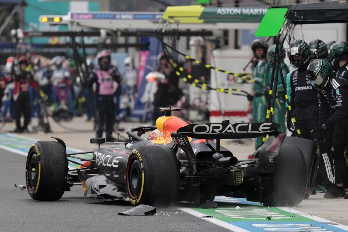 Formula One F1 - Miami Grand Prix - Miami International Autodrome, Miami, Florida, United States - May 3, 2025 Red Bull's Max Verstappen with a damaged front wing in the pit lane after he made contact with Mercedes' Andrea Kimi Antonelli REUTERS/Shawn Thew