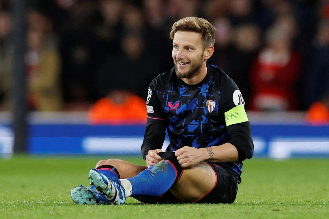 FILE PHOTO: Soccer Football - Champions League - Group B - Arsenal v Sevilla - Emirates Stadium, London, Britain - November 8, 2023 Sevilla's Ivan Rakitic reacts Action Images via Reuters/Peter Cziborra/File Photo