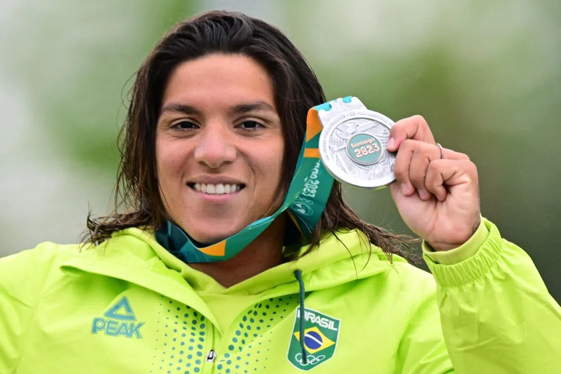 Brazil’s Ana Marcela Cunha celebrating her silver medal in the women's 10km open water marathon swimming final of the Pan American Games Santiago 2023, at the Los Morros lagoon in San Bernardo, Metropolitan Santiago, Chile, on October 29, 2023. The uncertainty over the venue for some of the swimming events at the 2024 Paris Games is worrying the reigning Olympic open water champion Cunha, who is calling for a "plan B" that prioritises the health of the athletes.