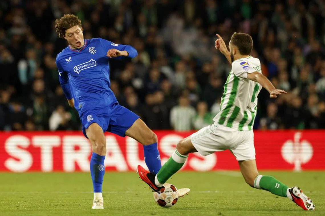 FILE PHOTO: Soccer Football - Europa League - Group C - Real Betis v Rangers - Estadio Benito Villamarin, Seville, Spain - December 14, 2023  Rangers' Sam Lammers in action with Real Betis' German Pezzella REUTERS/Marcelo Del Pozo/File Photo