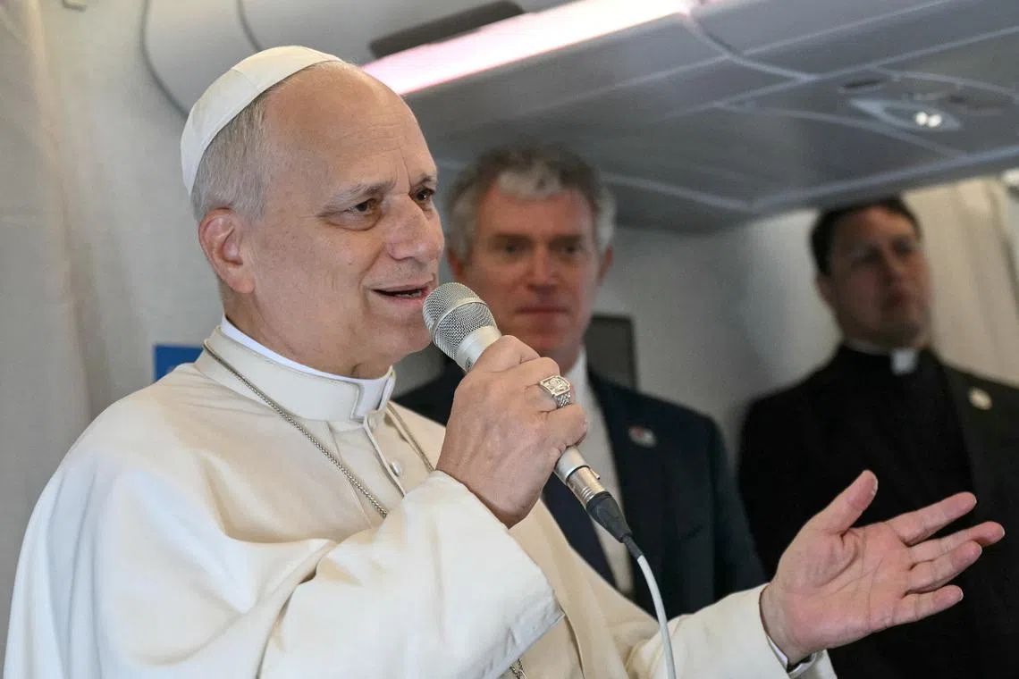 Pope Leo XIV addresses journalists during the flight heading to Malabo, Equatorial Guinea, as part of Pope apostolic journey to Africa, on April 21, 2026.