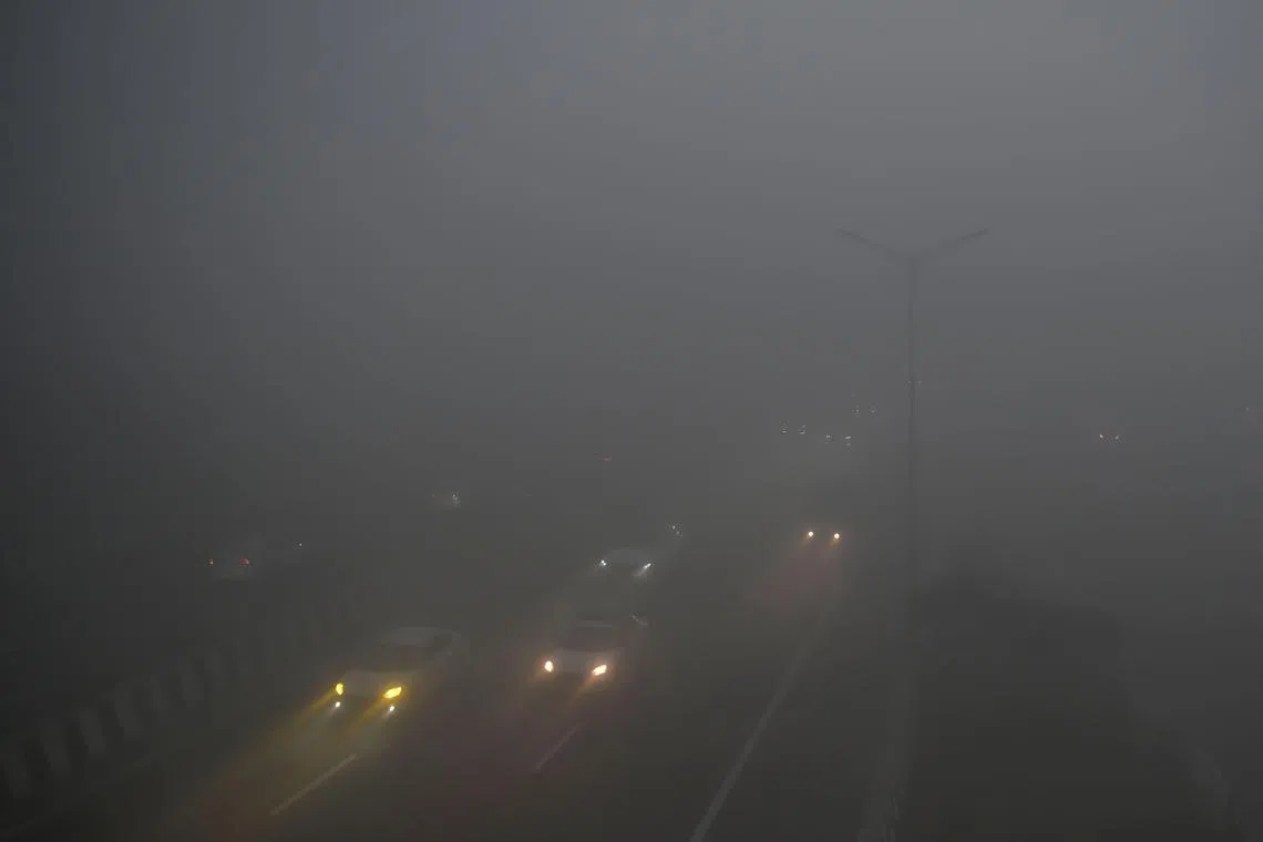 Local media showed images of vehicles crawling along highways through the fog.