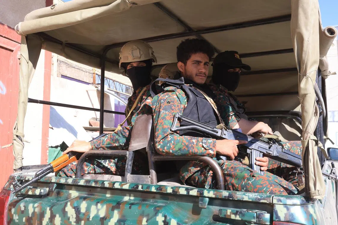Houthi soldiers riding a truck while on patrol in Sana'a, Yemen, on Jan 25.  The United Nations has suspended all official movements into and within areas held by Yemen's Houthis to ensure the safety of its employees after the Houthi authorities detained a number of UN personnel working in the areas under their control, according to a statement by the UN. 