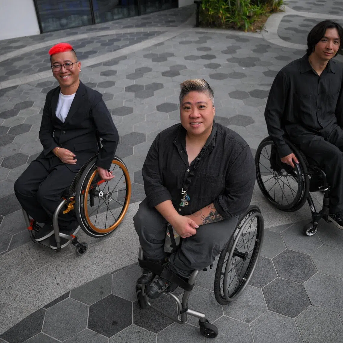 (From left) Para-athletes Jovin Tan, Theresa Goh, and Toh Wei Soong at the Singapore National Paralympic Council’s Athlete Achievement Awards dinner on March 24.