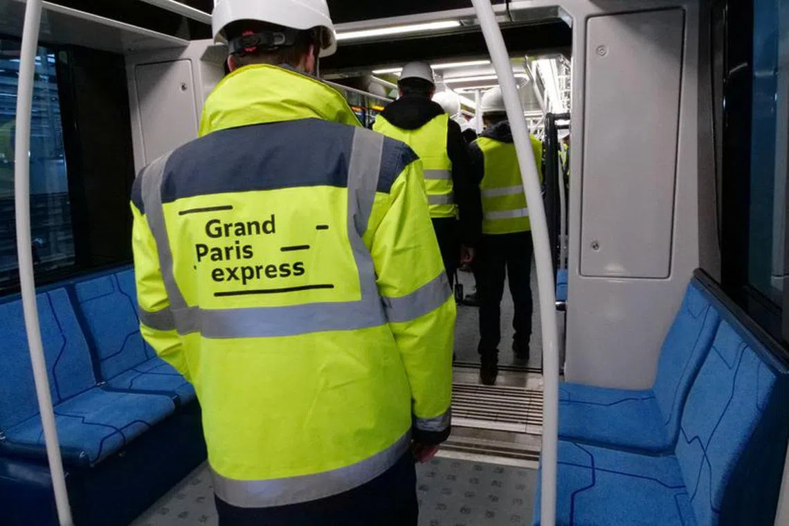 An employee attends the inauguration driving test of the Line 15, part of the Grand Paris Express project, at the railway station of Champigny-sur-Marne near Paris, France, November 28, 2023. REUTERS/Lucien Libert/ File photo