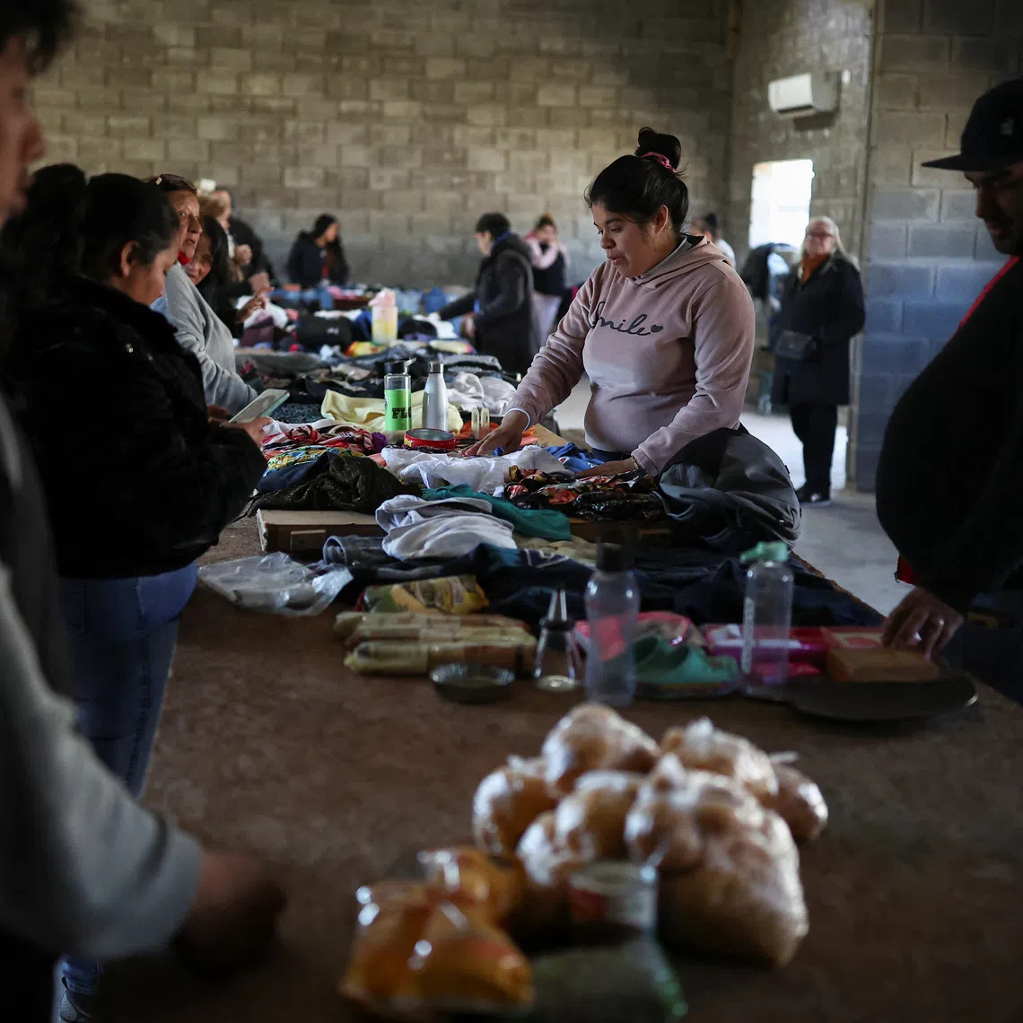People barter goods, as soup kitchens, barter clubs and families taking out short-term loans for groceries are exposing the social strains emerging under Argentine President Javier Milei's austerity program, barely a year before Argentina's next presidential election, in Lomas de Zamora, on the outskirts of Buenos Aires, Argentina, September 13, 2026. REUTERS/Agustin Marcarian