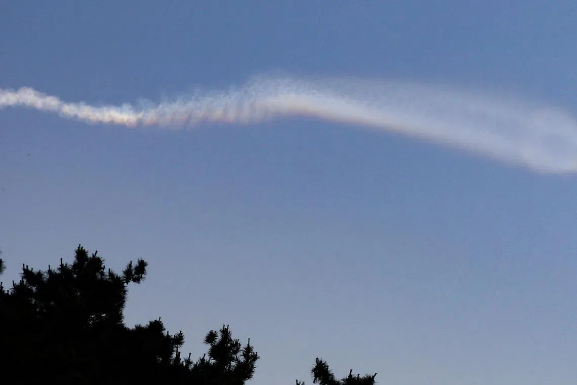 The contrail of North Korean missile is pictured from Yeonpyeong Island, South Korea, June 26, 2024.    Yonhap via REUTERS