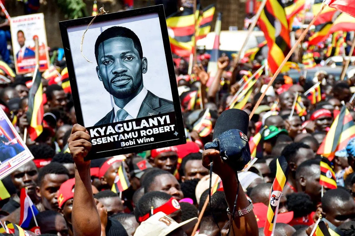 FILE PHOTO: Supporters of Ugandan Presidential candidate Robert Kyagulanyi, also known as Bobi Wine, of the National Unity Platform (NUP) party, attend his campaign caravan ahead of the general elections in Kampala, Uganda December 15, 2025. REUTERS/Abubaker Lubowa/File Photo