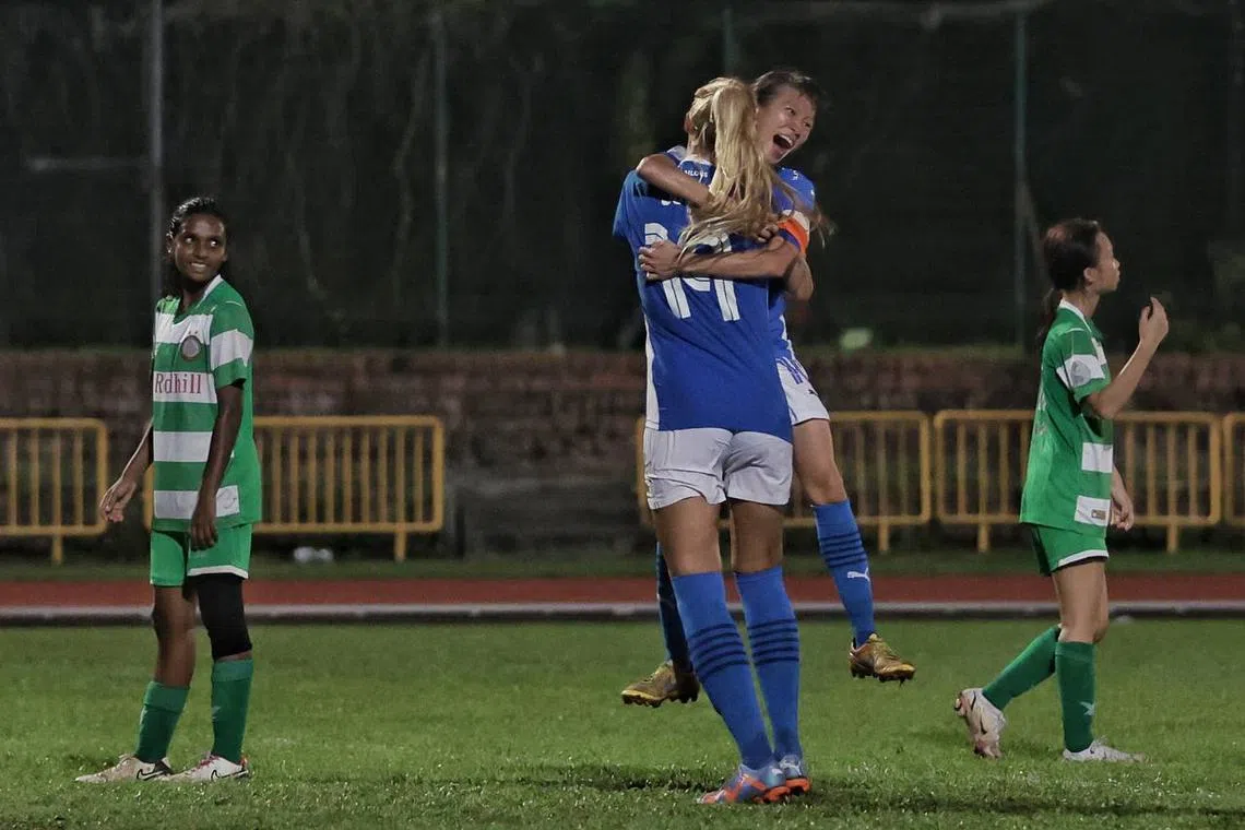Lion City Sailors’ captain Ho Hui Xin (right) celebrating with teammate Julia Farr after scoring in her team's 11-0 win over Geylang International.