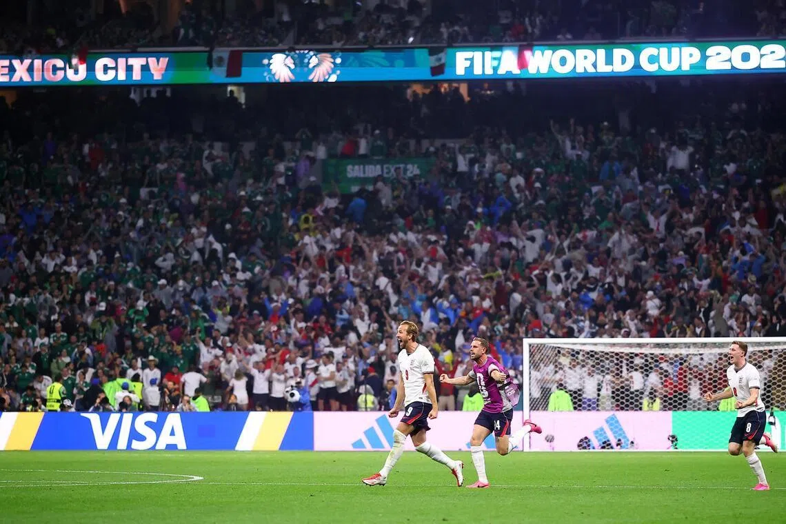 England’s Harry Kane, Jordan Henderson and Elliot Anderson celebrate after the match against Mexico.