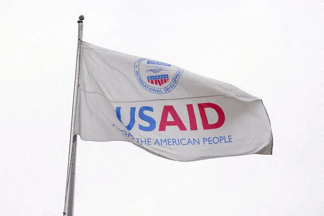 FILE PHOTO: A USAID flag flutters outside, as the USAID building sits closed to employees after a memo was issued advising agency personnel to work remotely, in Washington, D.C., U.S., February 3, 2025. REUTERS/Kent Nishimura/File Photo