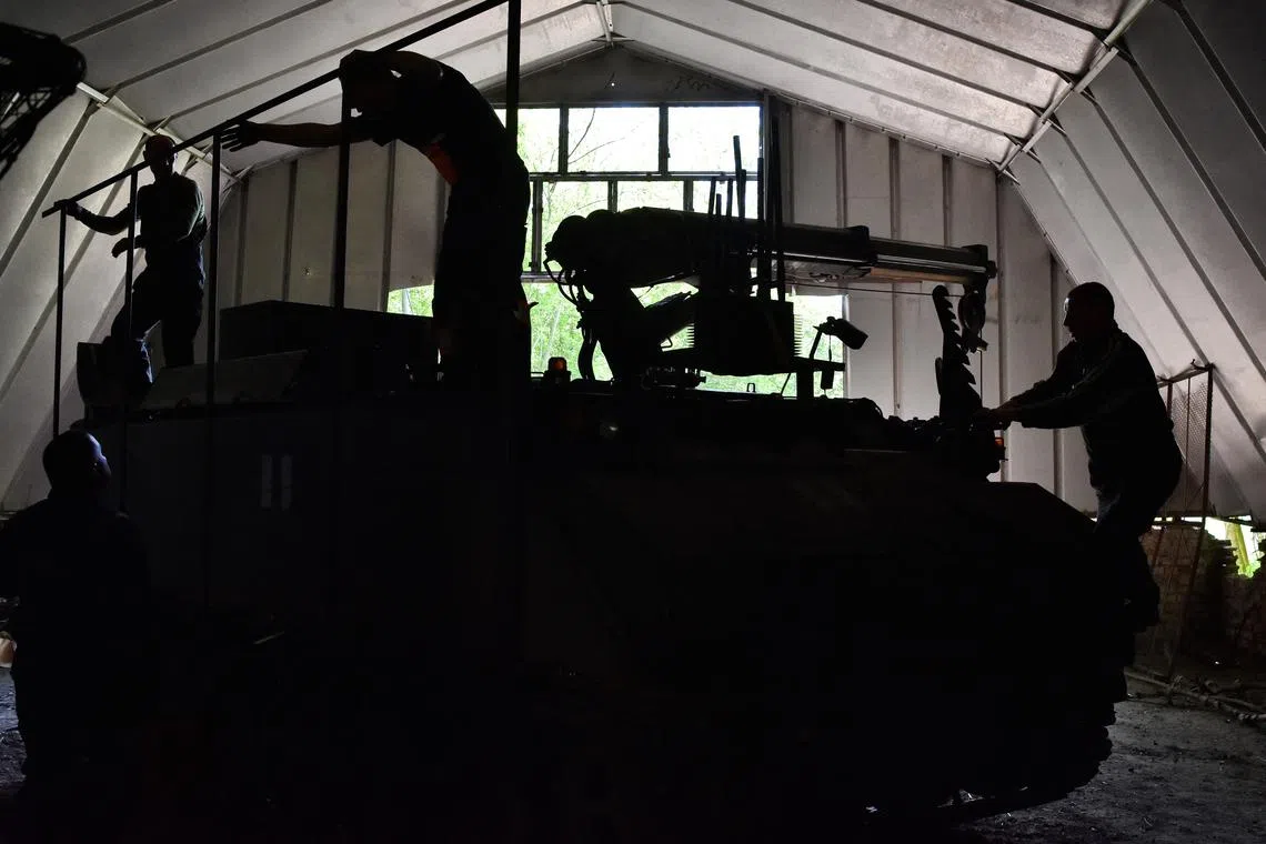 Servicemen of the 65th Separate Mechanized Brigade of the Ukrainian Armed Forces install an anti-drone protection on a YPR-806 PRBRG (Pantser-Rups Berging) armored repair and recovery vehicle, amid Russia's attack on Ukraine, in Zaporizhzhia region, Ukraine April 24, 2025. Andriy Andriyenko/Press Service of the 65th Separate Mechanized Brigade of the Ukrainian Armed Forces/Handout via REUTERS