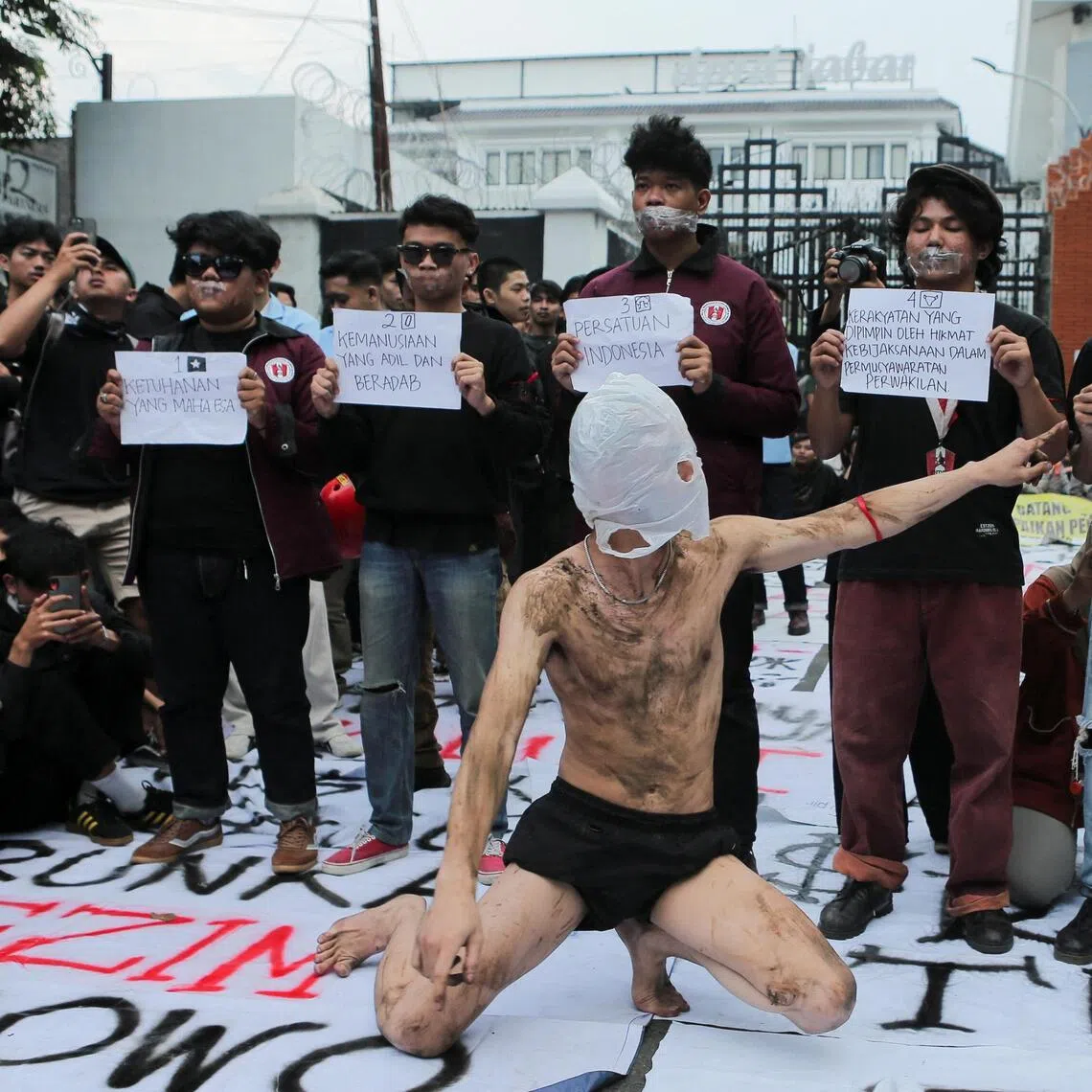 University students during a protest against government policies, including the free meals programme in Bandung, West Java province, Indonesia on June 15. 
