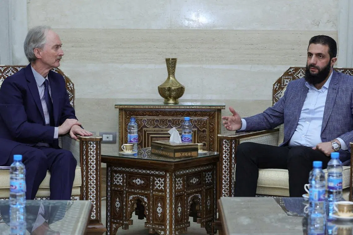 FILE PHOTO: U.N. Syria envoy Geir Pedersen meets with head of Hayat Tahrir al-Sham and Syria's de facto leader, Ahmed al-Sharaa, also known as Abu Mohammed al-Golani in Damascus, Syria in this handout released on December 15, 2024. Hayat Tahrir Al-Sham/Handout via REUTERS/File Photo