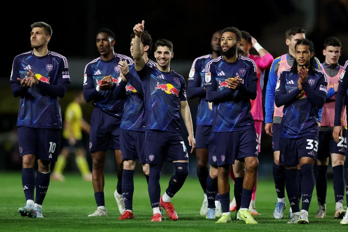 Soccer Football - Championship - Oxford United v Leeds United - Kassam Stadium, Oxford, Britain - April 18, 2025 Leeds United's Manor Solomon celebrates after the match with teammates Action Images/Paul Childs