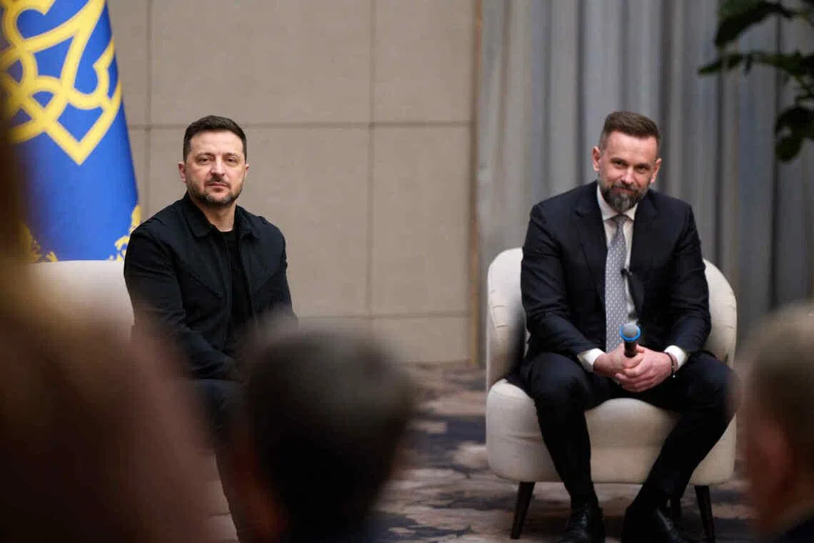 Ukrianian President Volodymyr Zelensky (left) taking questions during a visit to Ukraine's western Zakarpattia region on April 9.