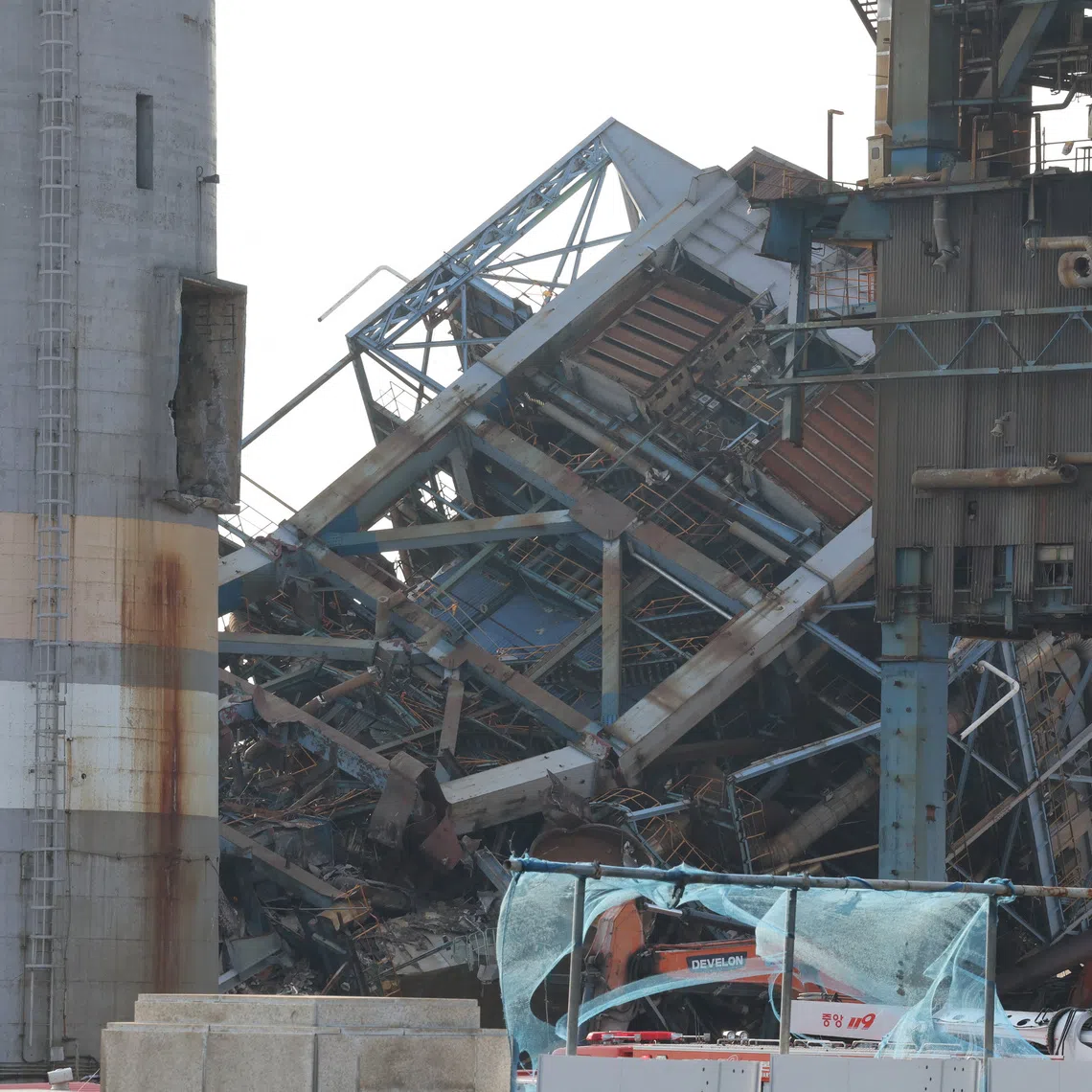 The workers were working on the massive steel structure to weaken its base to prepare for demolition when it collapsed five days ago.