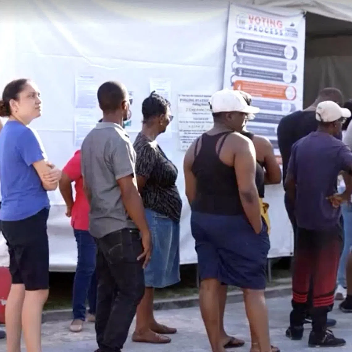 People wait to cast their vote during the general election in Georgetown, Guyana, September 1, 2025, in this screen grab taken from a video. Reuters TV/via REUTERS