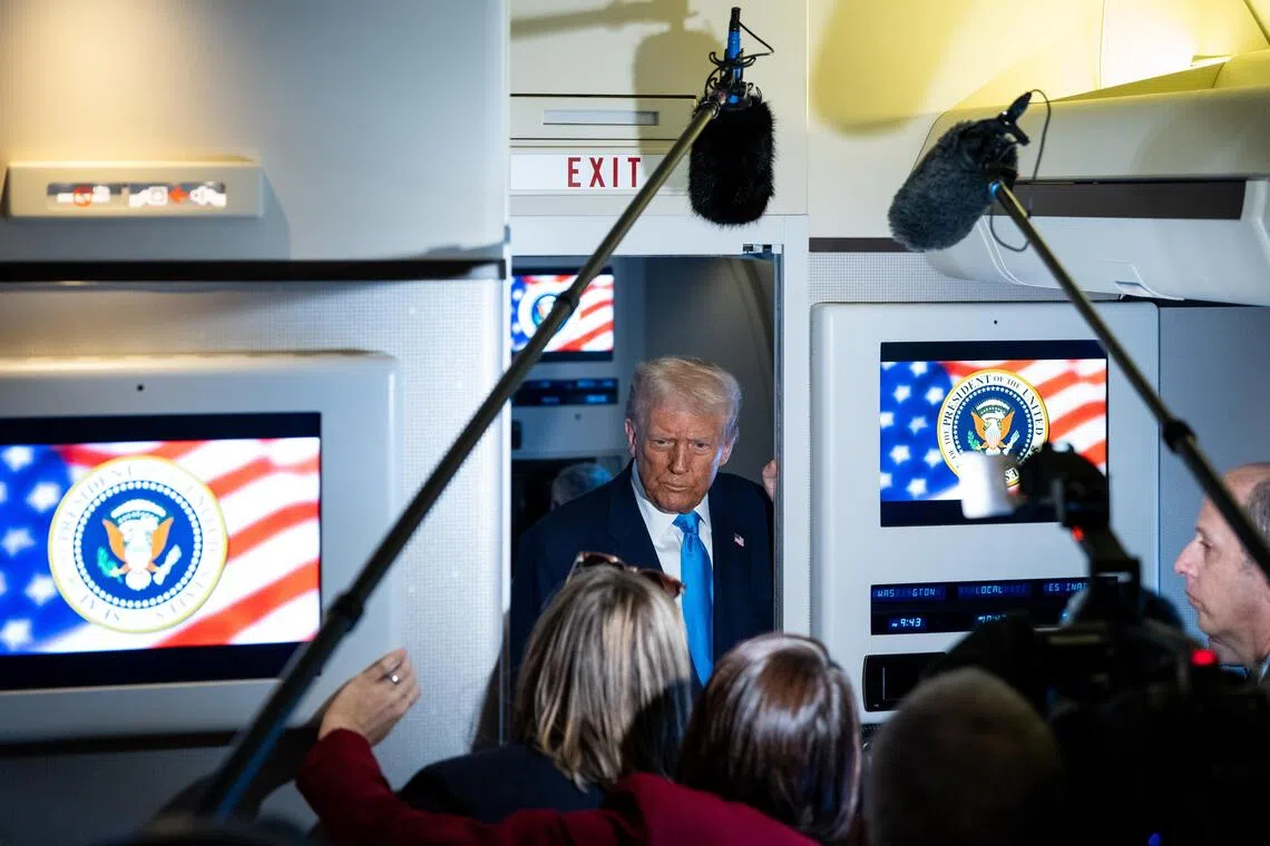 US President Donald Trump speaking to reporters aboard Air Force One on Oct 30, after his meeting with Chinese President Xi Jinping.