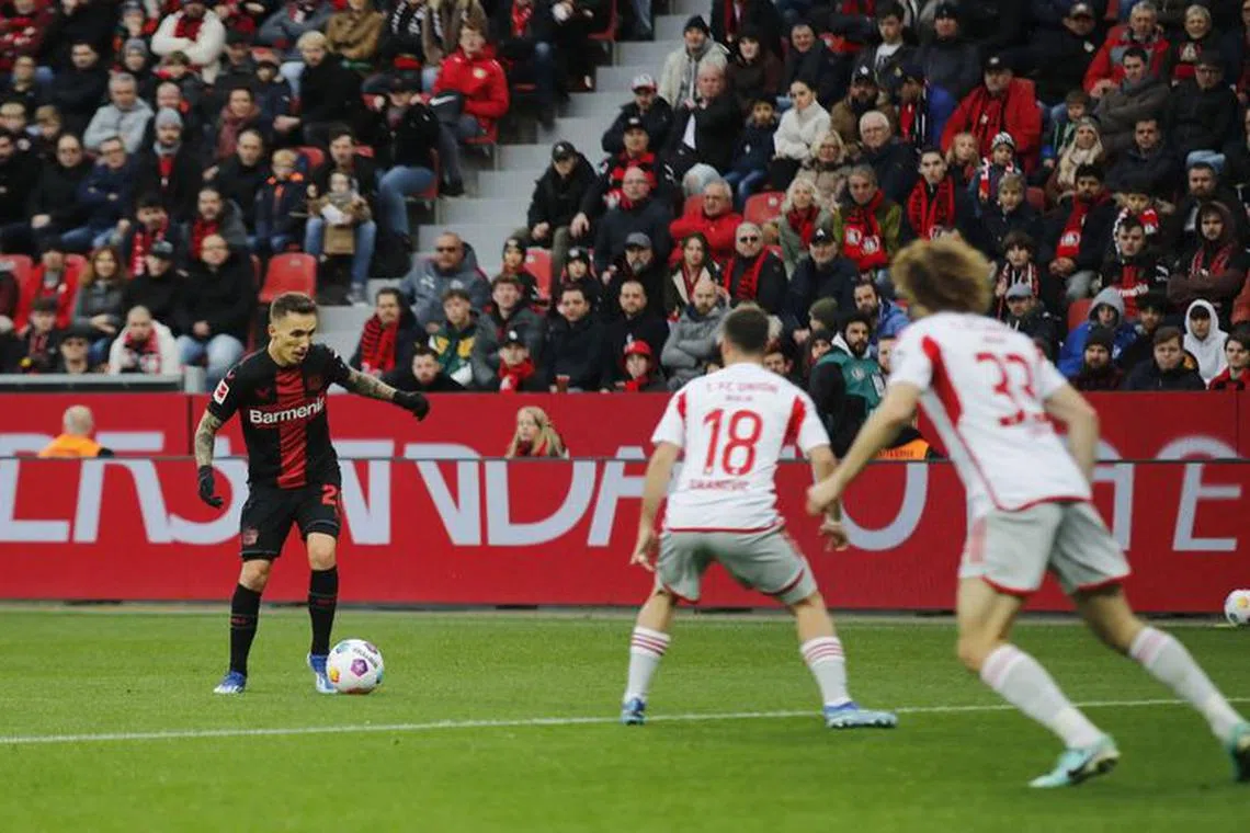 Soccer Football - Bundesliga - Bayer Leverkusen v 1. FC Union Berlin - BayArena, Leverkusen, Germany - November 12, 2023 Bayer Leverkusen's Alejandro Grimaldo in action before he scores their first goal REUTERS/Thilo Schmuelgen DFL REGULATIONS PROHIBIT ANY USE OF PHOTOGRAPHS AS IMAGE SEQUENCES AND/OR QUASI-VIDEO.