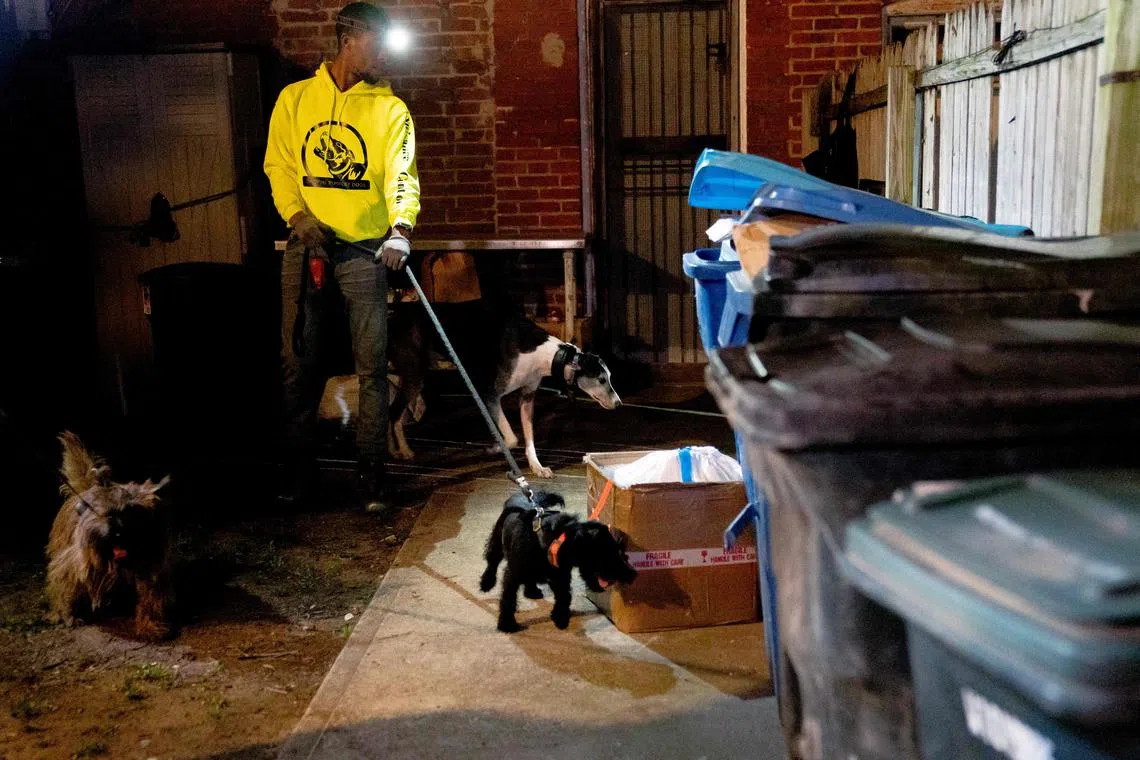 A group of rat hunters searching for rats in the Adams Morgan neighborhood of Washington, DC, on June 3, 2023. 