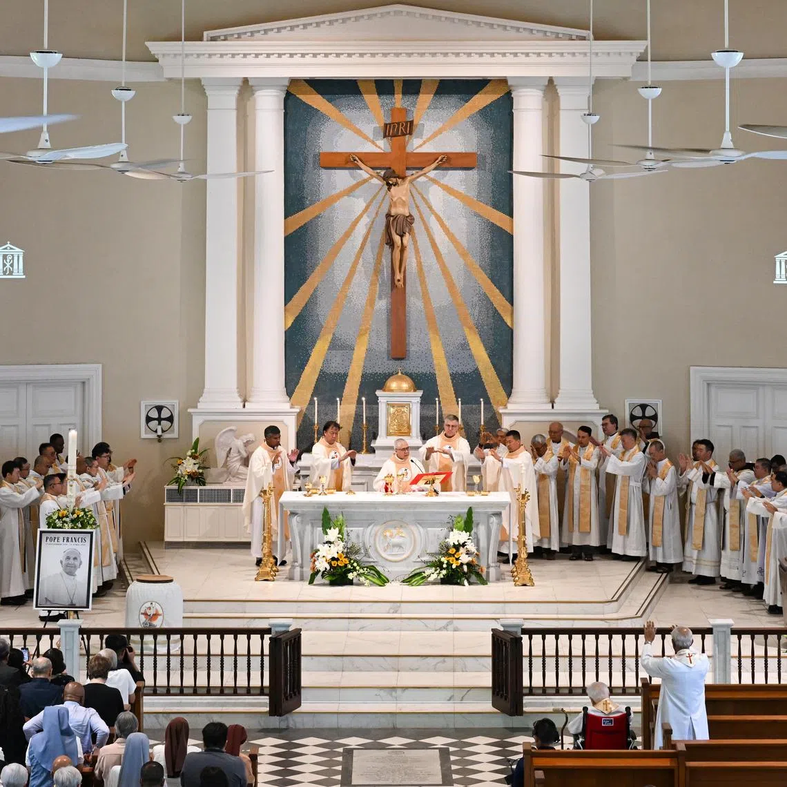 ST20250422_202598900851-Lim Yaohui-Joakim Kang-jkmass22/
Cardinal William Goh consecrating the bread and wine, during the liturgy of the eucharist, at the memorial mass for Pope Francis at the Cathedral of the Good Shepard on April 22, 2025.
The Catholic Archdiocese is holding a memorial mass for Pope Francis at the Cathedral of the Good Shepard and will be celebrated by His Eminence, Cardinal William Goh, the Archbishop of Singapore.
(ST PHOTO: LIM YAOHUI)