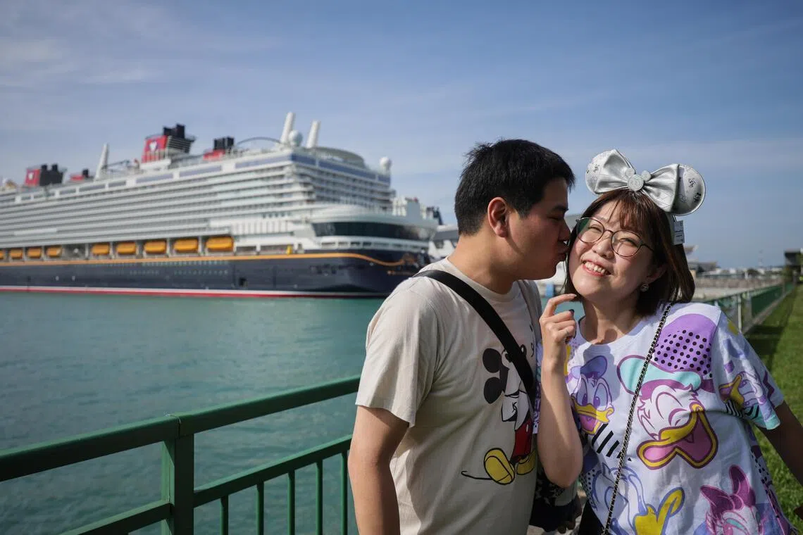 Japanese husband and wife Takuya and Manami Murao were among the first group to check in for the Disney Adventure’s inaugural public sailing.