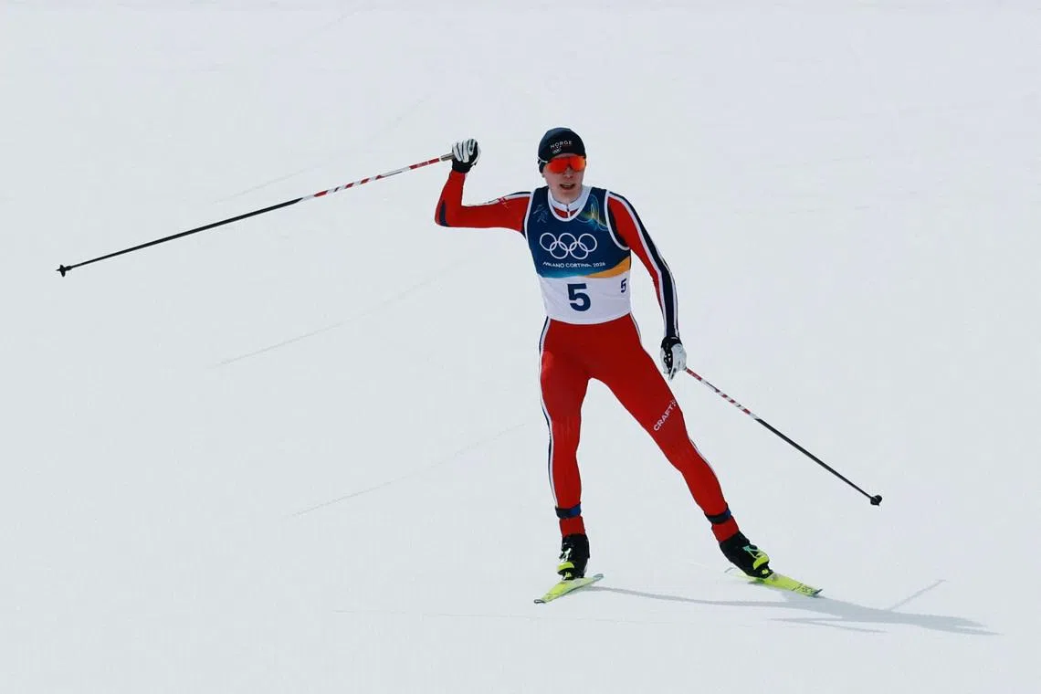 Milano Cortina 2026 Olympics - Nordic Combined - Individual Gundersen Large Hill/10km, Cross-Country - Tesero Cross-Country Skiing Stadium, Lago, Italy - February 17, 2026. Jens Luraas Oftebro of Norway crosses the finish line to win the Individual Gundersen Large Hill/10km, Cross-Country REUTERS/Stephanie Lecocq