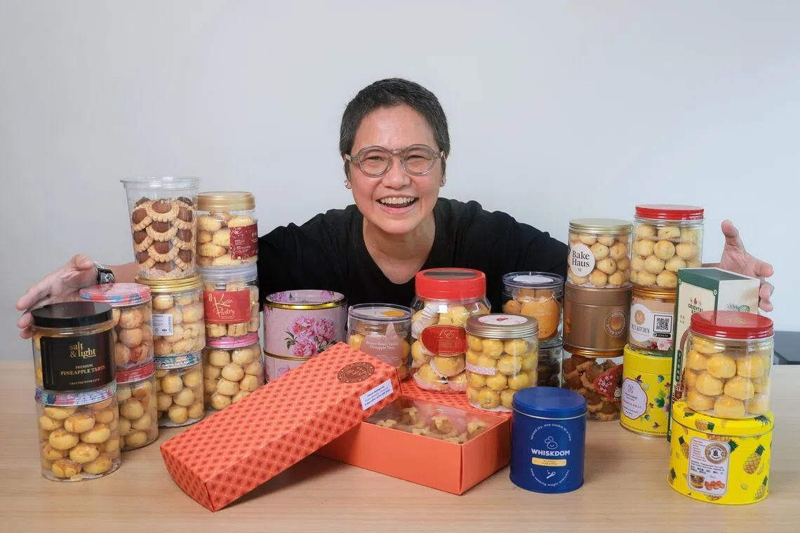 Private dining chef and content creator Shen Tan with 27 types of tarts she ordered to taste and review.