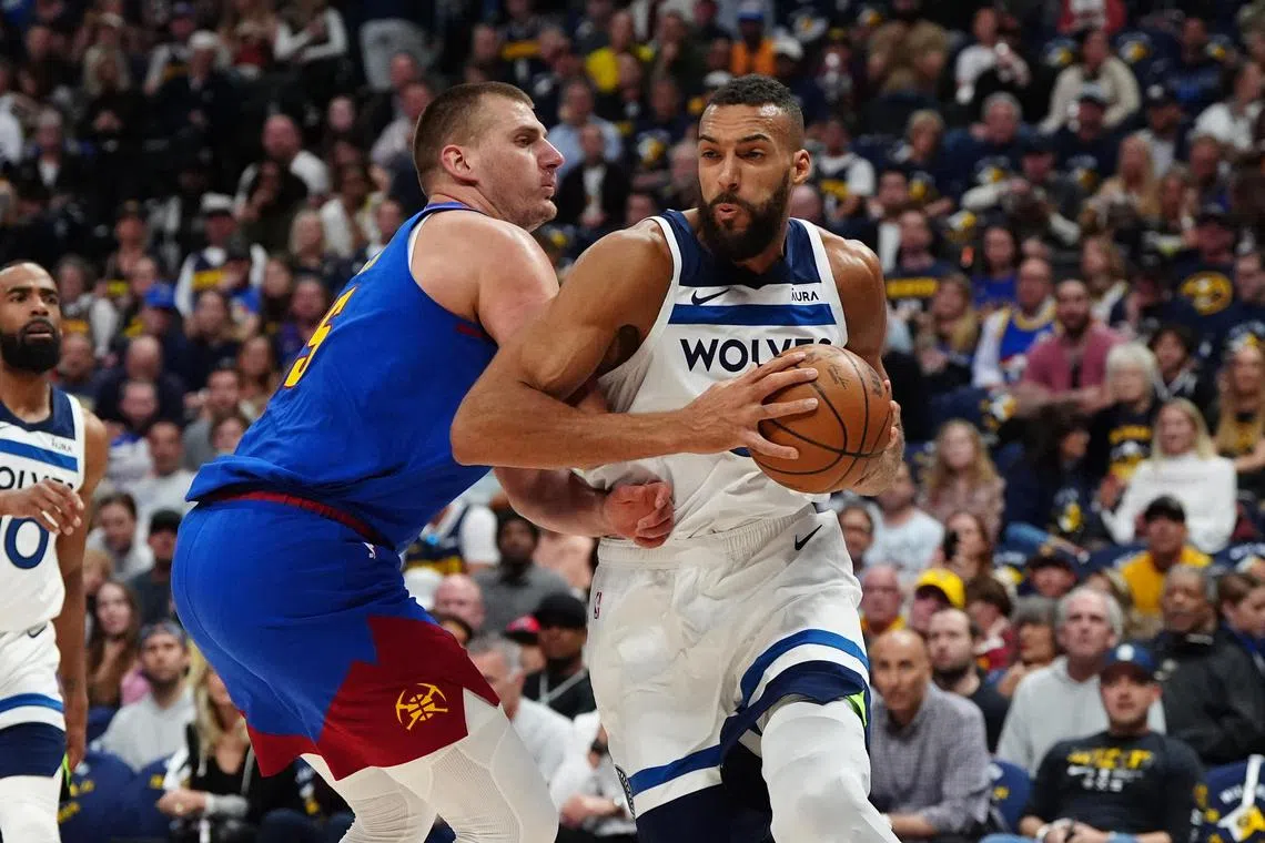 Minnesota Timberwolves centre Rudy Gobert and Denver Nuggets centre Nikola Jokic battling in the first quarter during Game 1 of the NBA semi-final, play-offs.