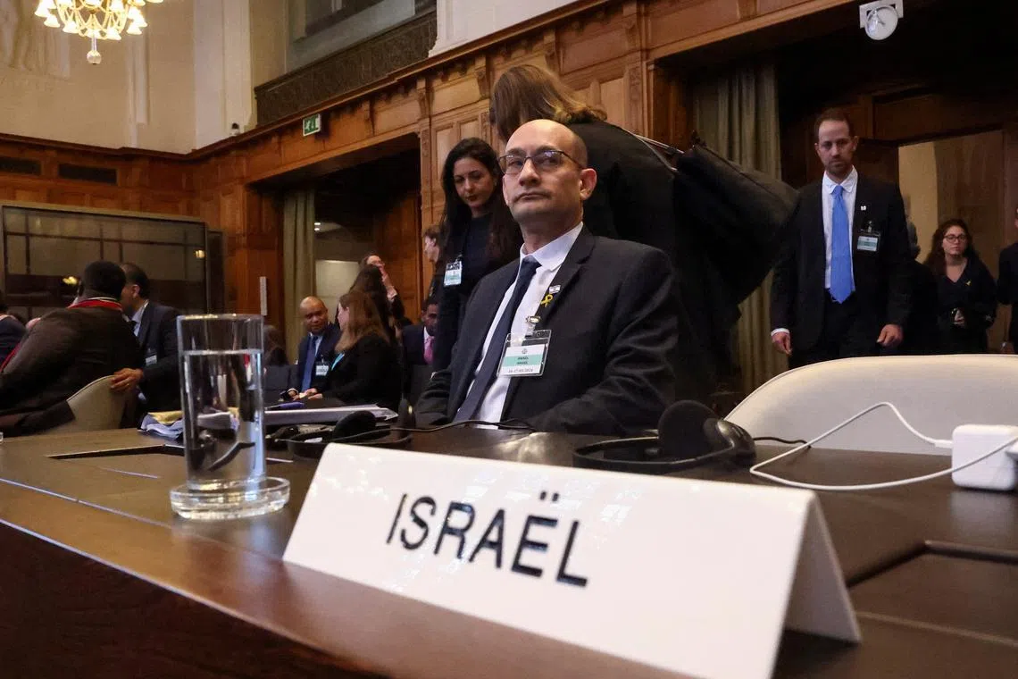 Israeli delegation members sit at the International Court of Justice (ICJ), at the start of a hearing where South Africa requests new emergency measures over Israel's attacks on Rafah, as part of an ongoing case South Africa filed at the ICJ in December last year accusing Israel of violating the Genocide Convention during its offensive against Palestinians in Gaza, in The Hague Netherlands May 17, 2024. REUTERS/Yves Herman