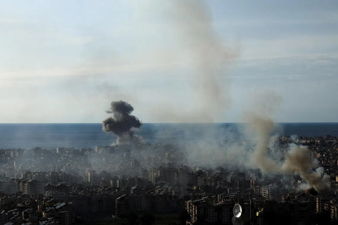 Smoke rises over Beirut’s southern suburbs following an air strike by Israeli forces against the Iran-backed militant group Hezbollah.