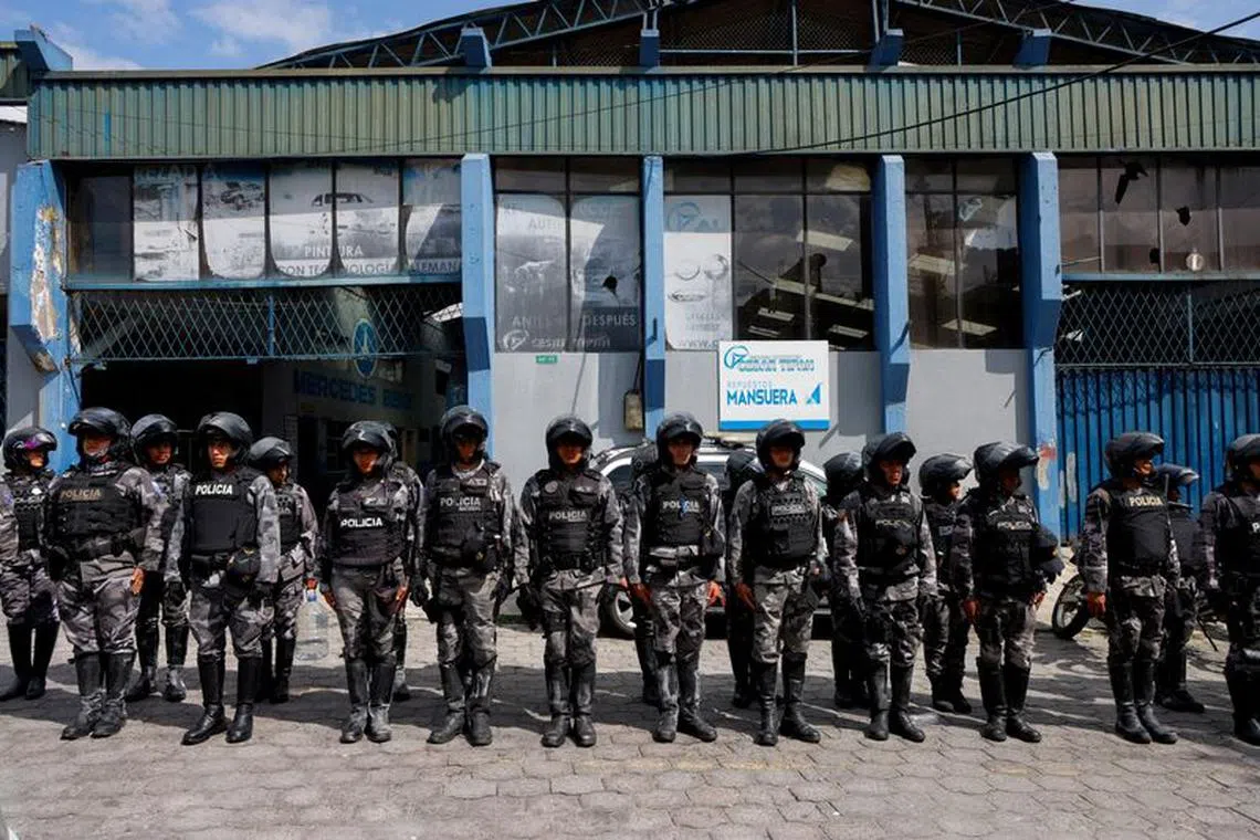 FILE PHOTO: Police officers stand in formation outside El Inca prison after a security operation due to riots, following the disappearance of Jose Adolfo Macias, alias 'Fito', leader of the Los Choneros criminal group, in Quito, Ecuador, January 8, 2024. REUTERS/Karen Toro/File Photo