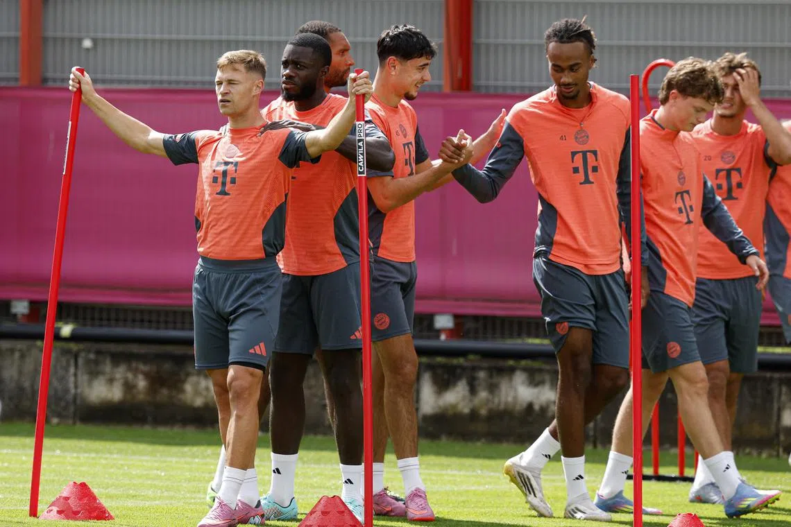 FILE PHOTO: Soccer Football - Bayern Munich Training - Saebener Strasse, Munich, Germany - July 31, 2025 Bayern Munich's Joshua Kimmich with Dayot Upamecano and teammates during training REUTERS/Heiko Becker/File Photo