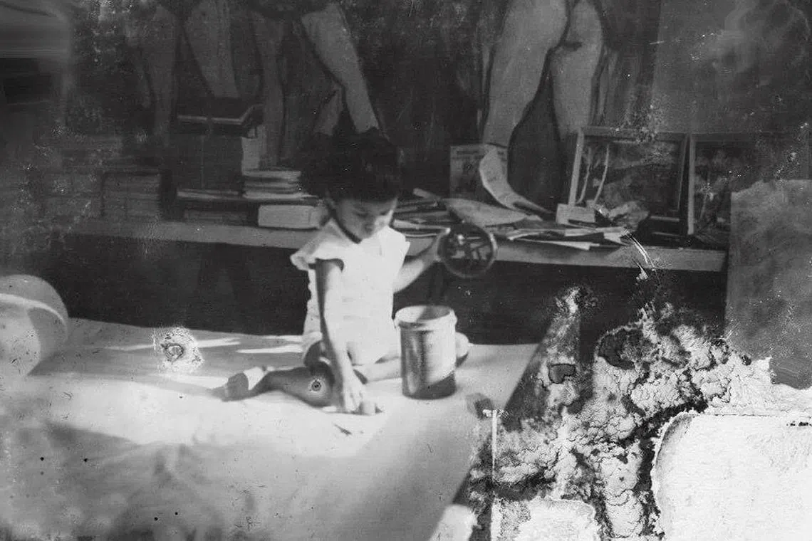 Karen Hoisington in her father’s studio when she was a toddler. 