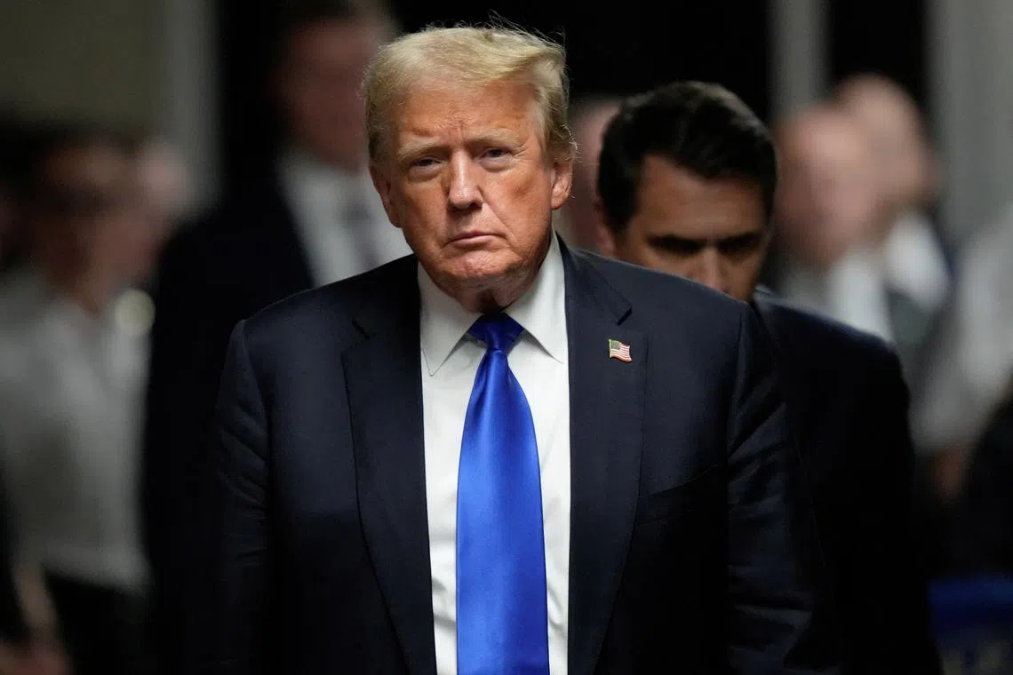 FILE PHOTO: Former President Donald Trump walks to make comments to members of the media after being found guilty on 34 felony counts of falsifying business records in the first degree at Manhattan Criminal Court, Thursday, May 30, 2024, in New York. Seth Wenig/Pool via REUTERS