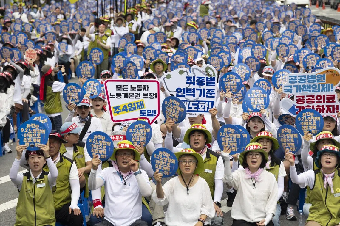 Members of the Korean Health and Medical Workers' Union take part in a rally against the government's labor policy in Seoul, South Korea, on July 2, 2025.