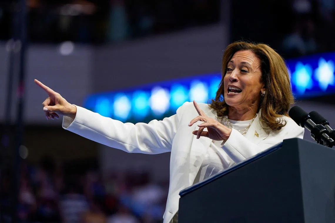Democratic presidential nominee and U.S. Vice President Kamala Harris gestures as she delivers remarks at a campaign rally in Savannah, Georgia, U.S., August 29, 2024. REUTERS/Elizabeth Frantz