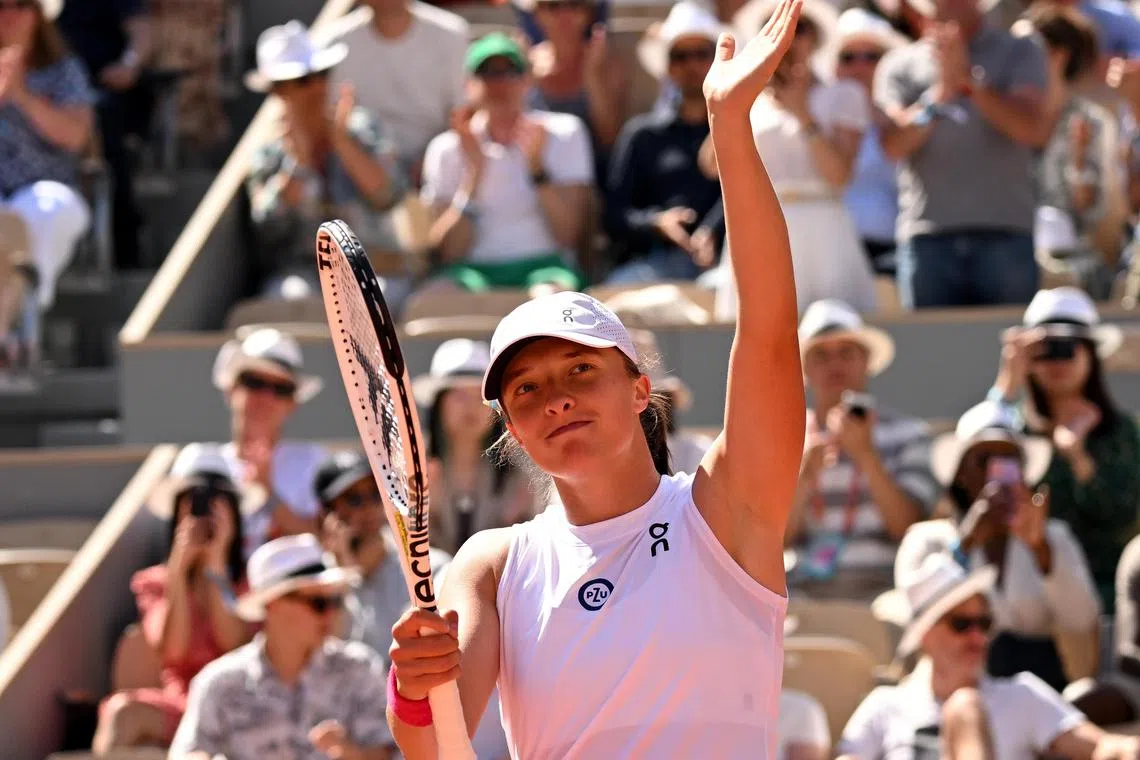 Poland's Iga Swiatek celebrates her 6-0, 6-0 win against China's Wang Xinyu.