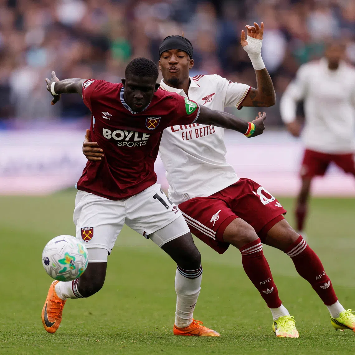 FILE PHOTO: Soccer Football - Premier League - West Ham United v Arsenal - London Stadium, London, Britain - May 10, 2026 West Ham United's El Hadji Malick Diouf in action with Arsenal's Noni Madueke Action Images via Reuters/Andrew Couldridge
