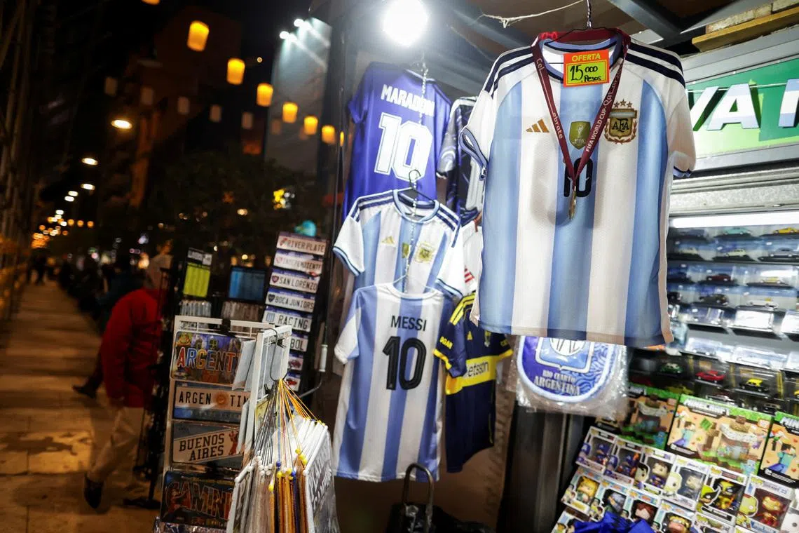 Argentina national soccer team unauthorised replica jerseys are displayed for sale at a newsstand, as World Cup fever in Argentina boosts sales of fake merchandise while inflation and sluggish economic activity make it harder for fans to buy original goods, in Buenos Aires, Argentina, May 22, 2026. REUTERS/Francisco Loureiro