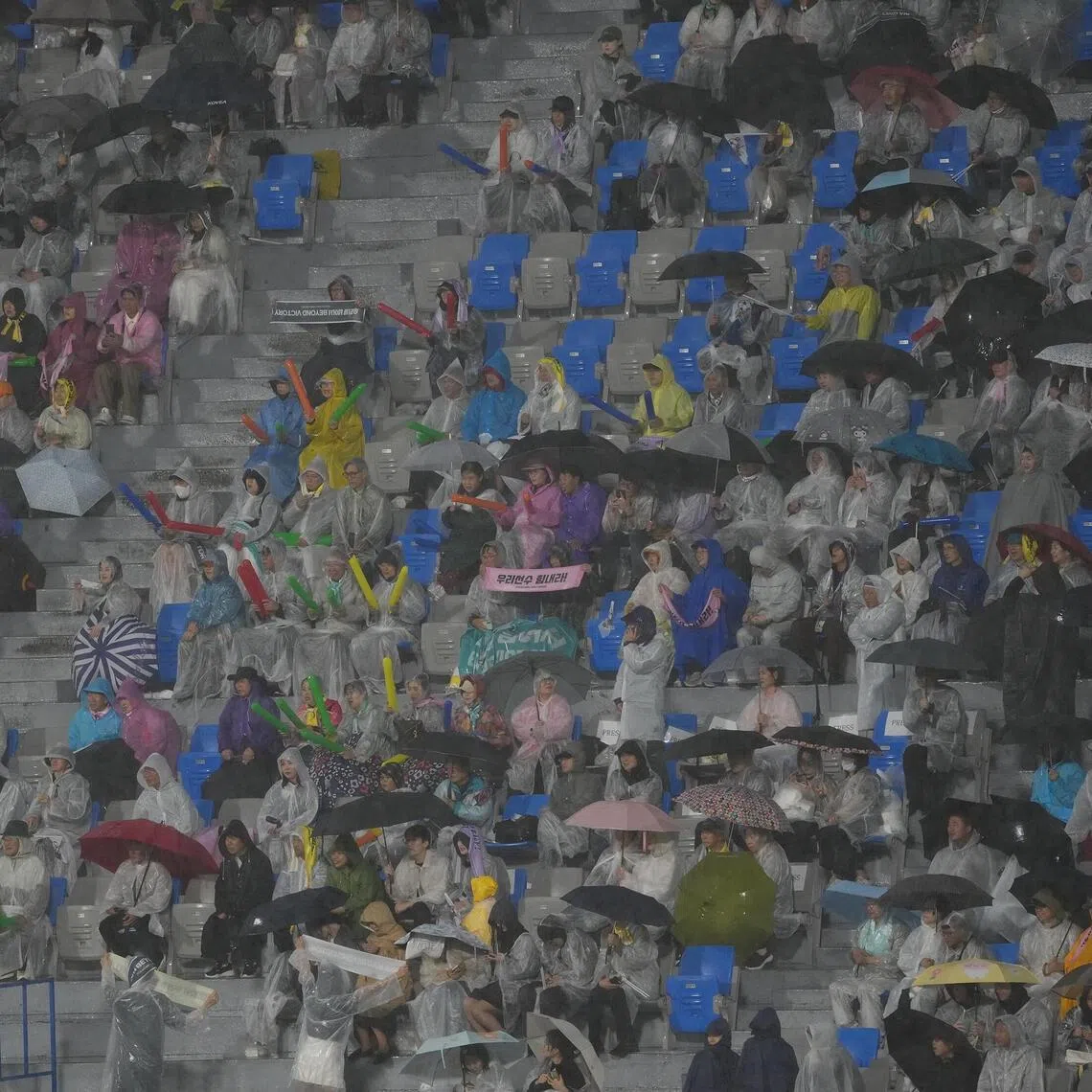 Fans cheer in the stands during a match against North Korea's Naegohyang Women’s FC vs. South Korea's Suwon FC in Suwon, South Korea on May 20.